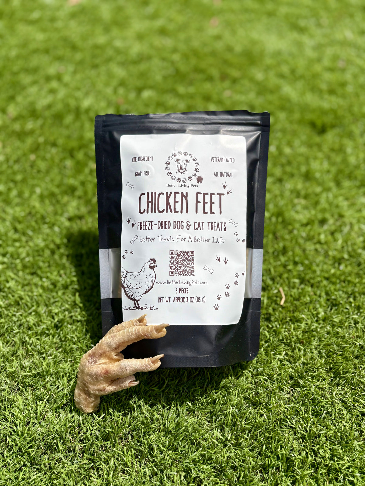 Bag of chicken feet treats for dogs on a grassy background